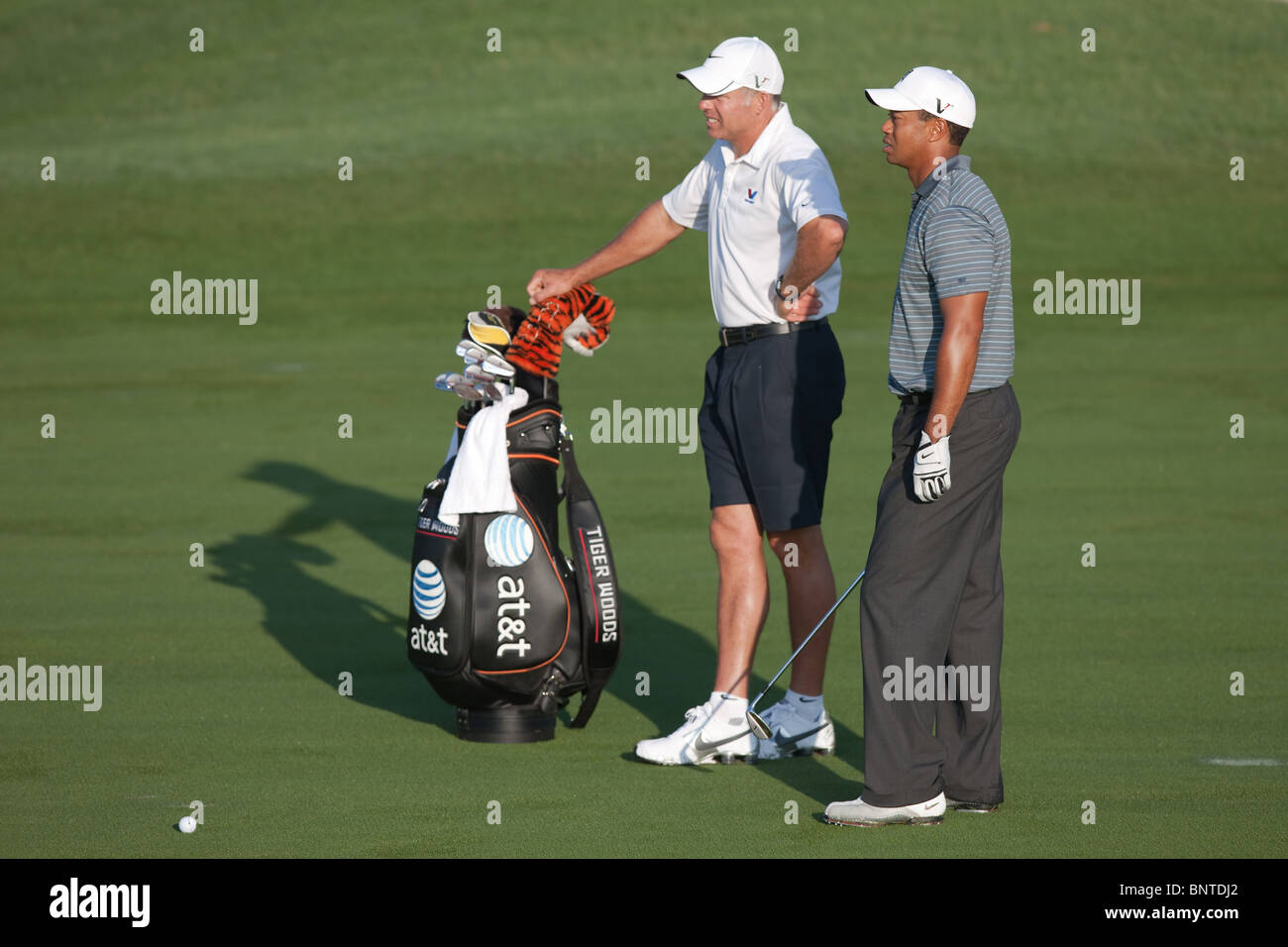 Tiger Woods and caddie Steve Williams wait for the green to clear during 2009 Players championship practice round. Stock Photo