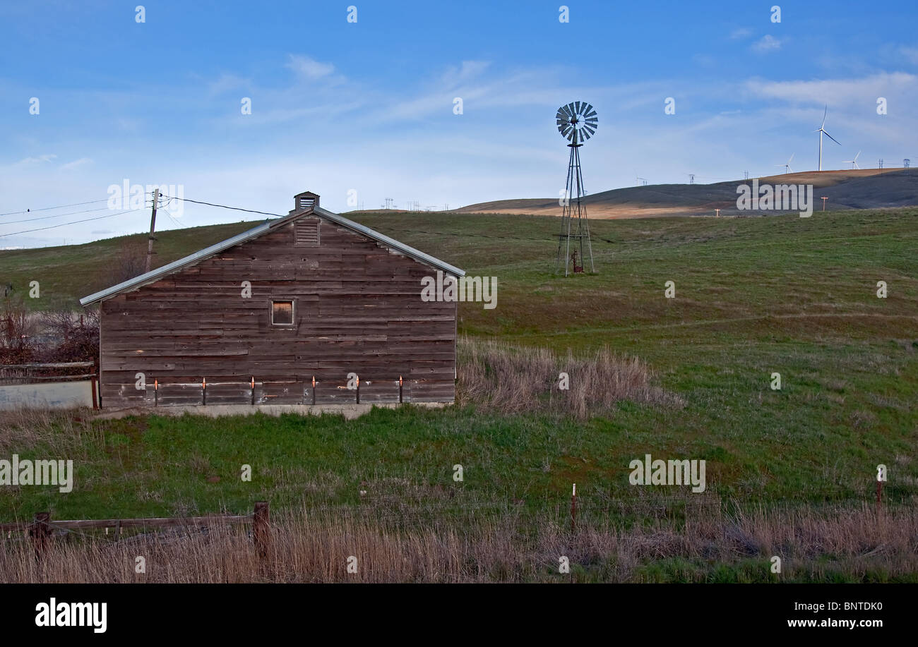 This rural farmland depicts an old rustic barn on gently rolling hills