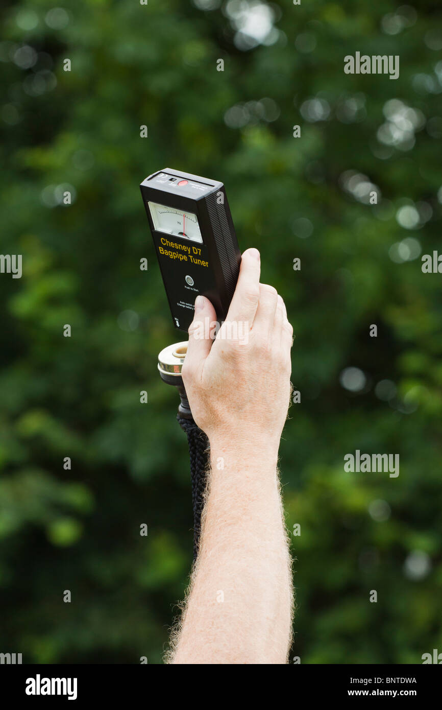 Tuning bagpipes with Chesney bagpipe tuner Stock Photo Alamy