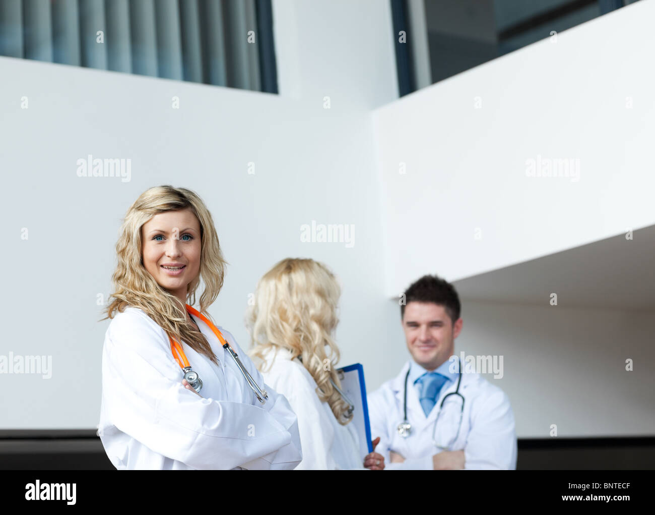 Three doctors in a hospital Stock Photo