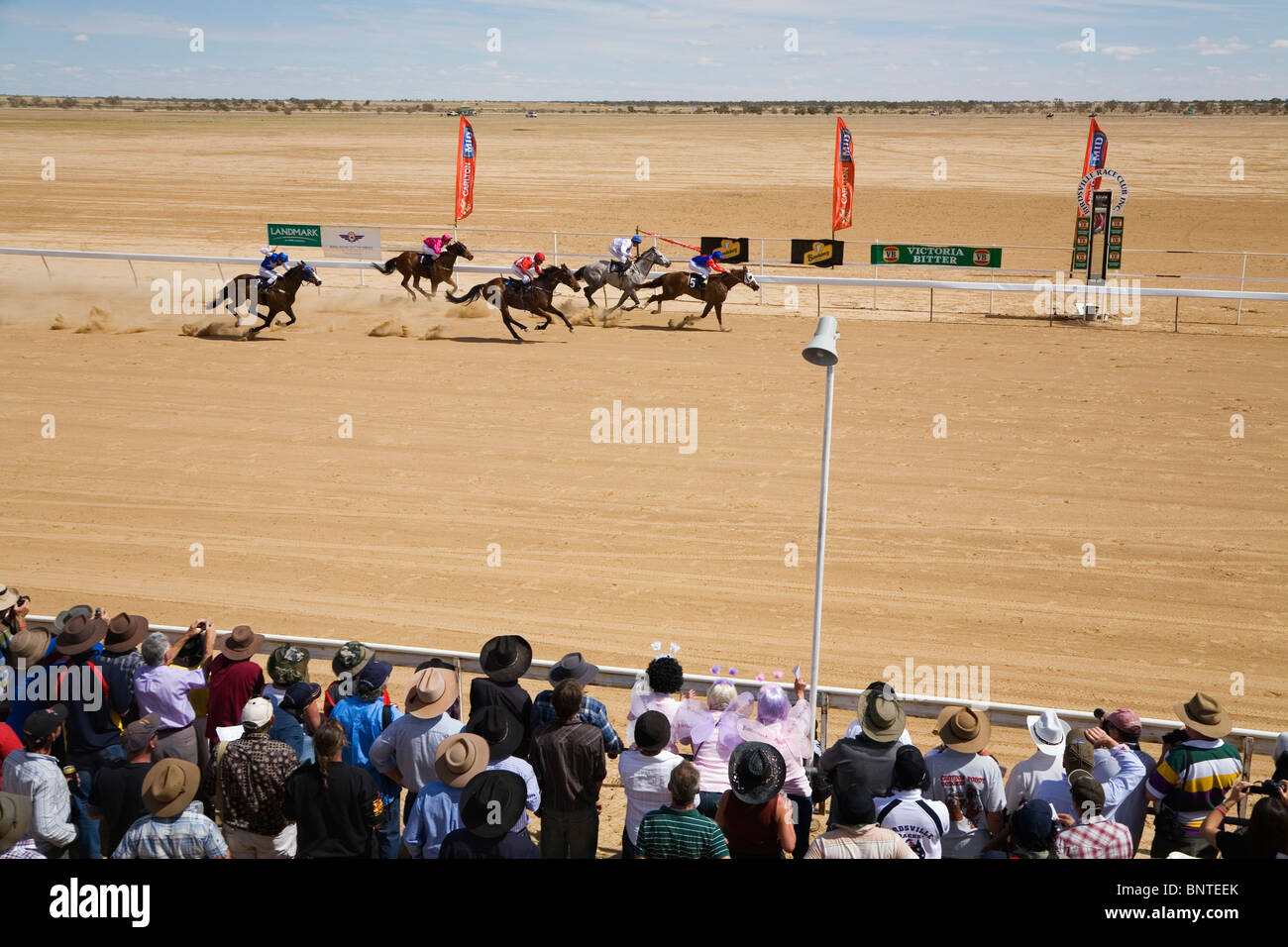 Horse racing in the outback at the Birdsville Cup Races. Birdsville, Queensland, AUSTRALIA. Stock Photo
