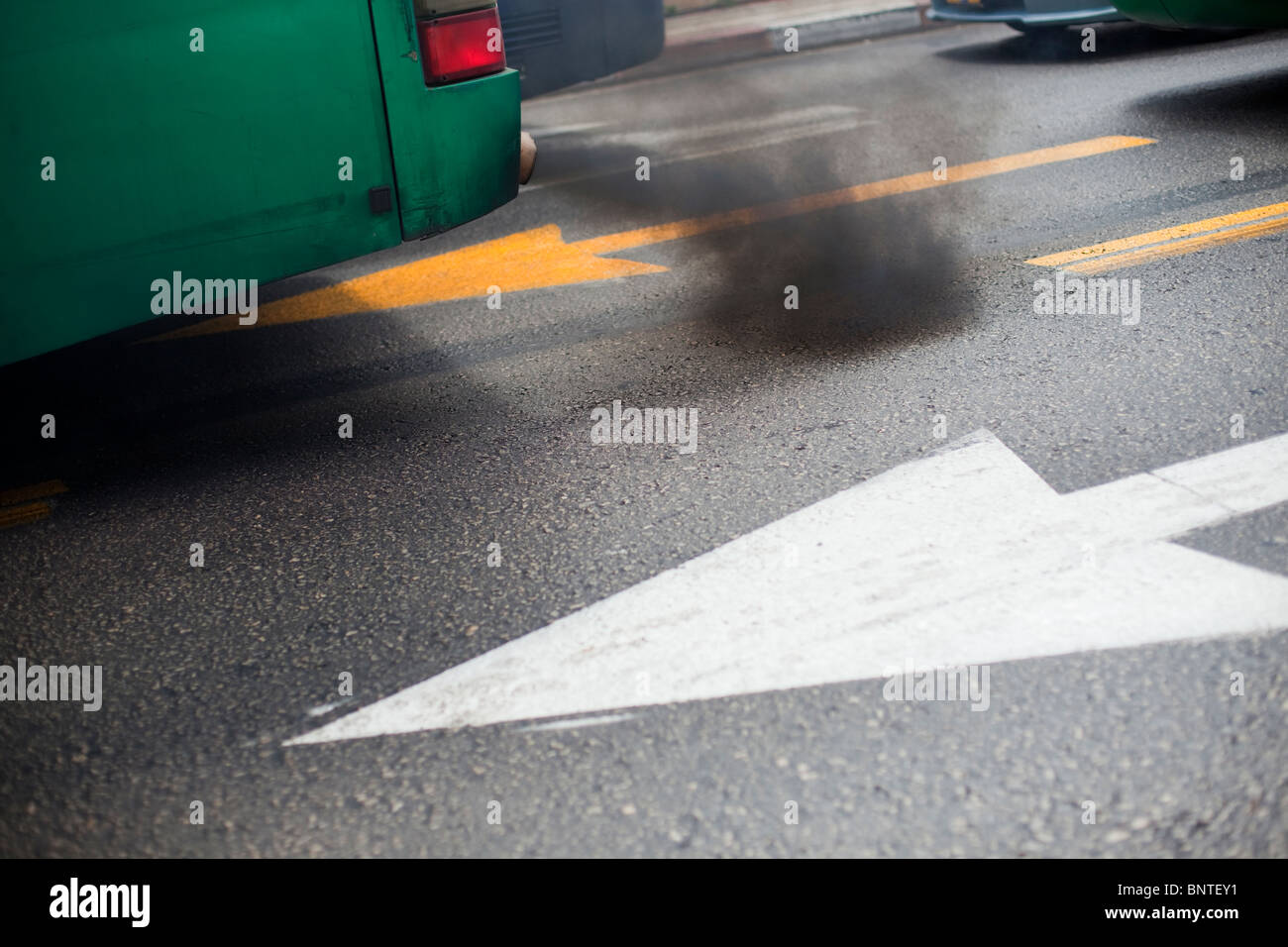 Black smoke gushed from the exhaust of a city bus in Tel Aviv Israel Stock Photo