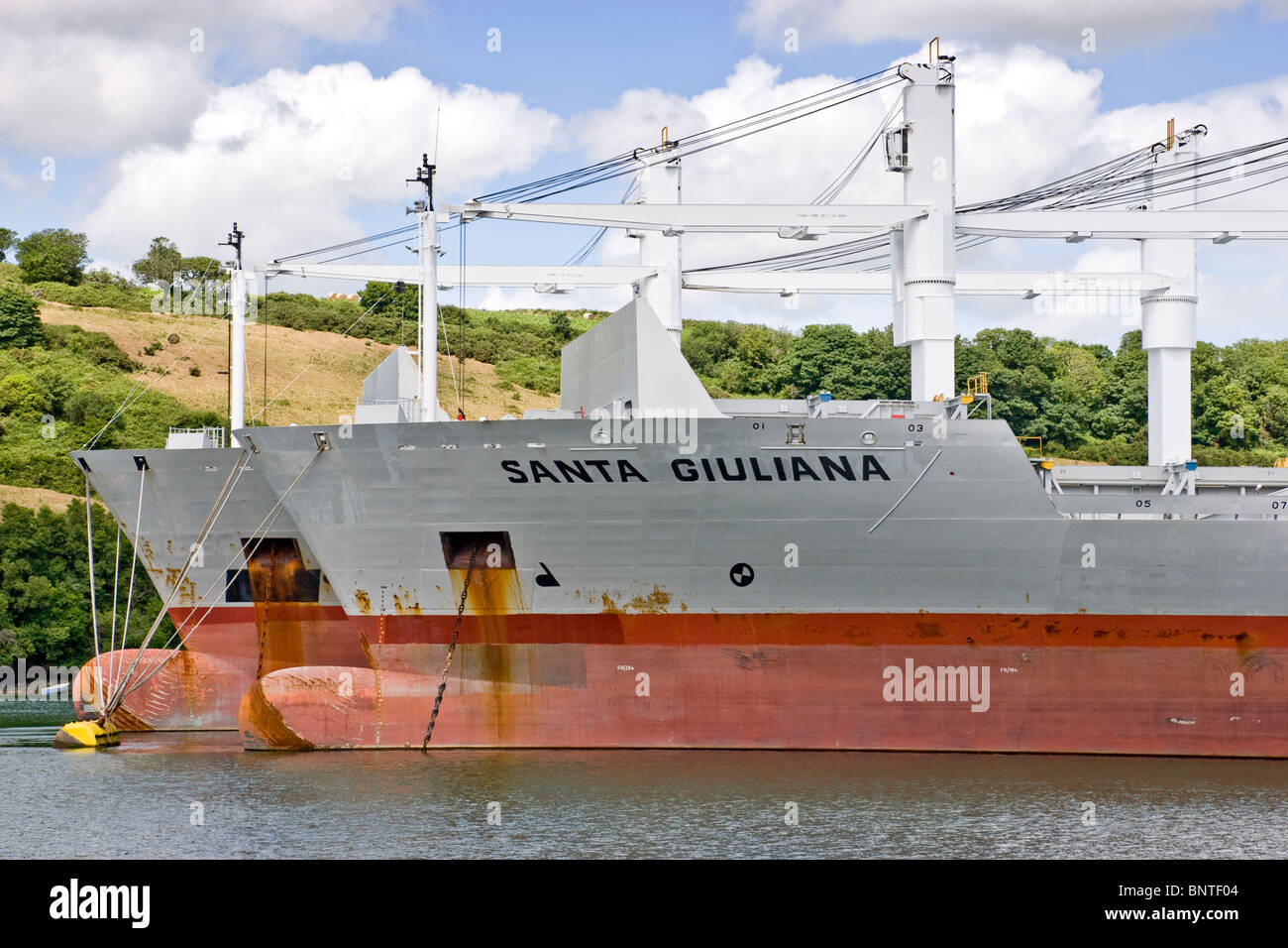 Container ships Santa Giuliana and Santa Giulietta moored at Tolverne on the River Fal, Cornwall, England Stock Photo