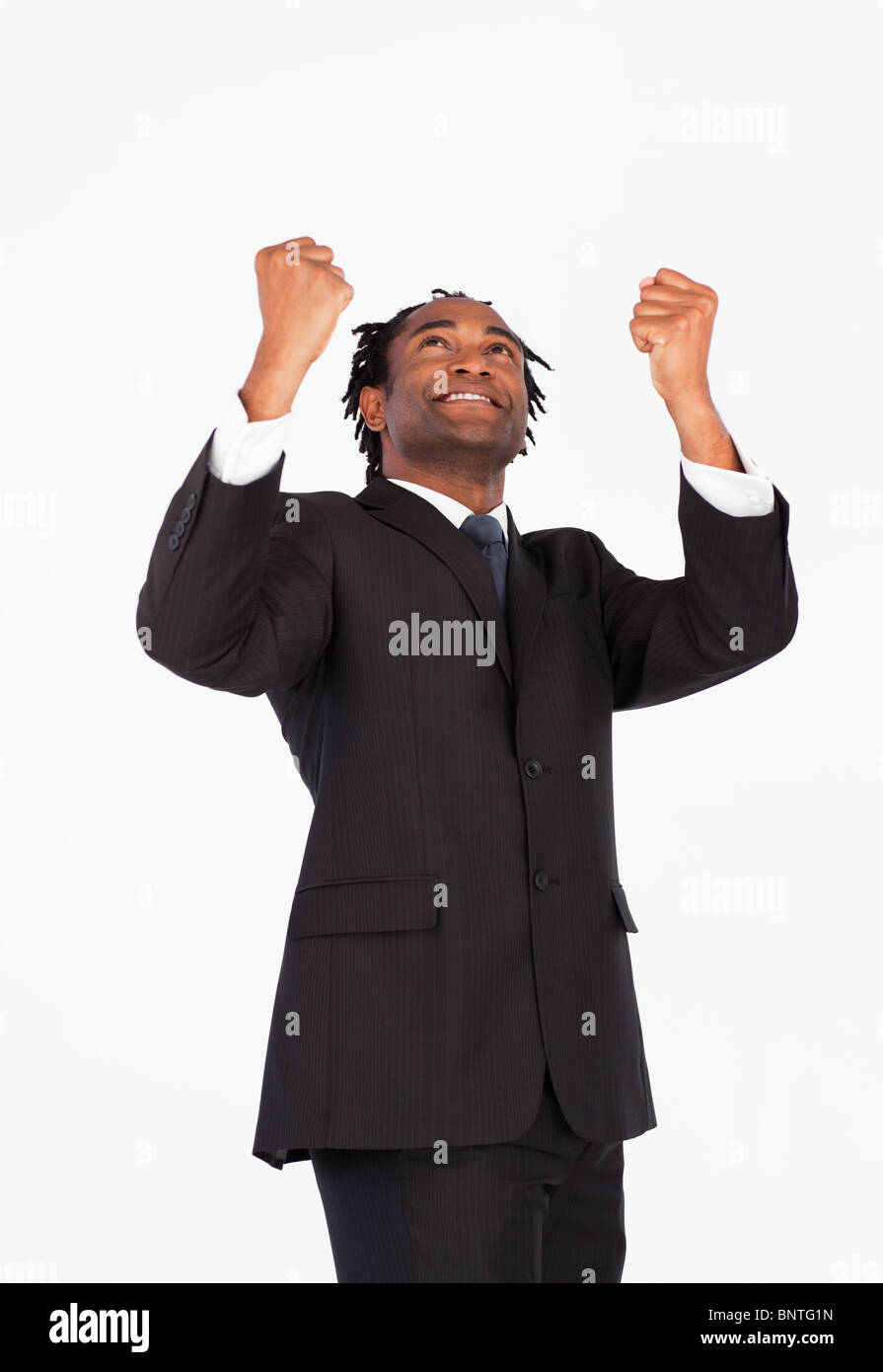 Handsome businessman with raised arms Stock Photo - Alamy