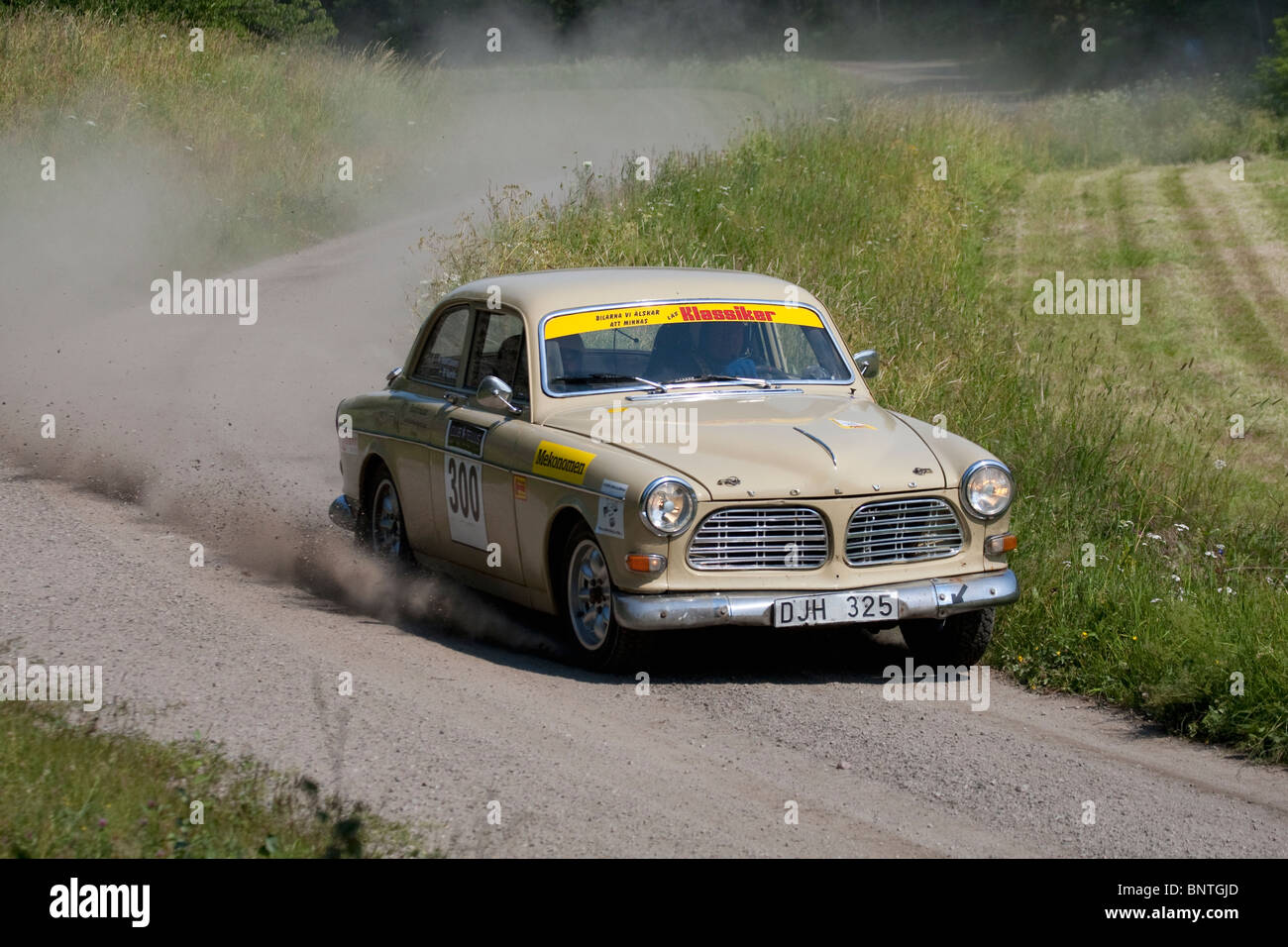 Old swedish  rallycar on gravelroad,Classic Racing. Stock Photo