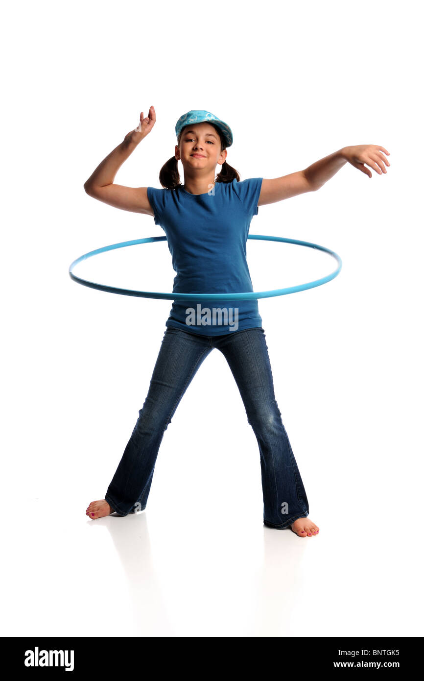 Young girl playing with hula hoop isolated over white background Stock Photo