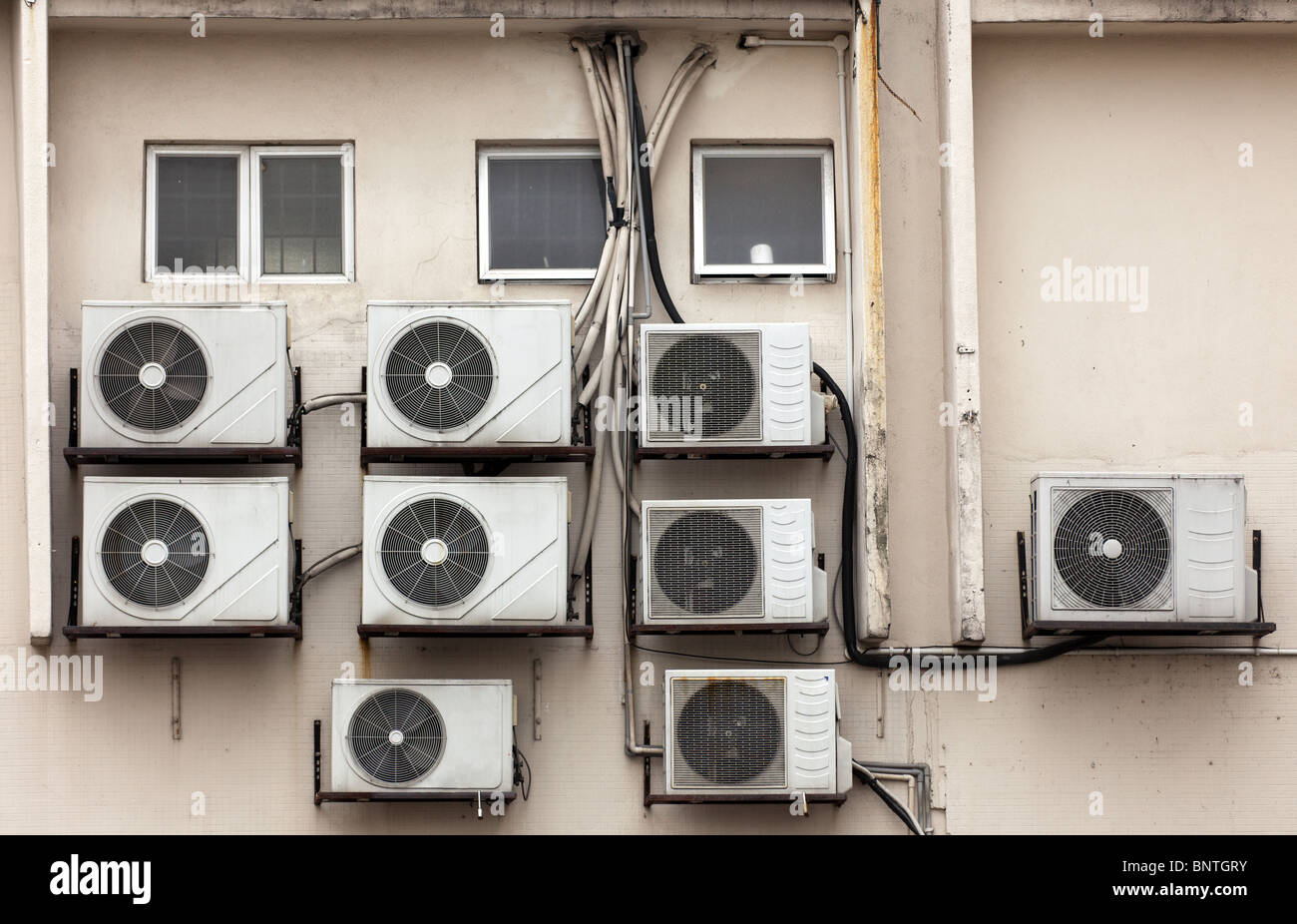 group of air conditioner units on wall in malaysia Stock Photo Alamy