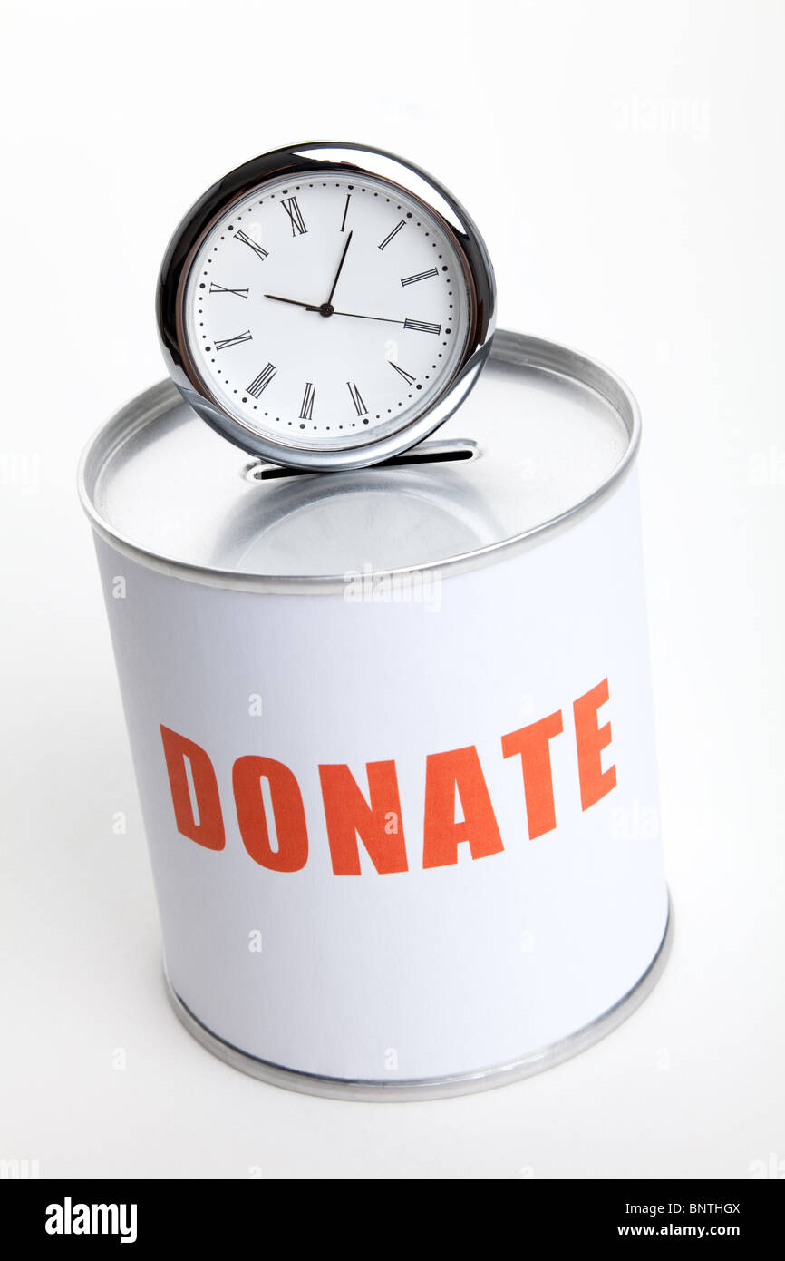Donation Box and clock, Concept of 'time to donate' or 'donate your time'. Stock Photo