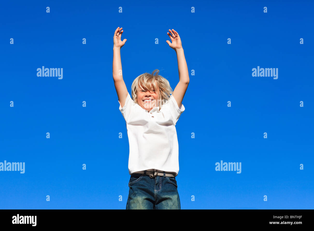 Happy kid Jumping in the air Stock Photo - Alamy