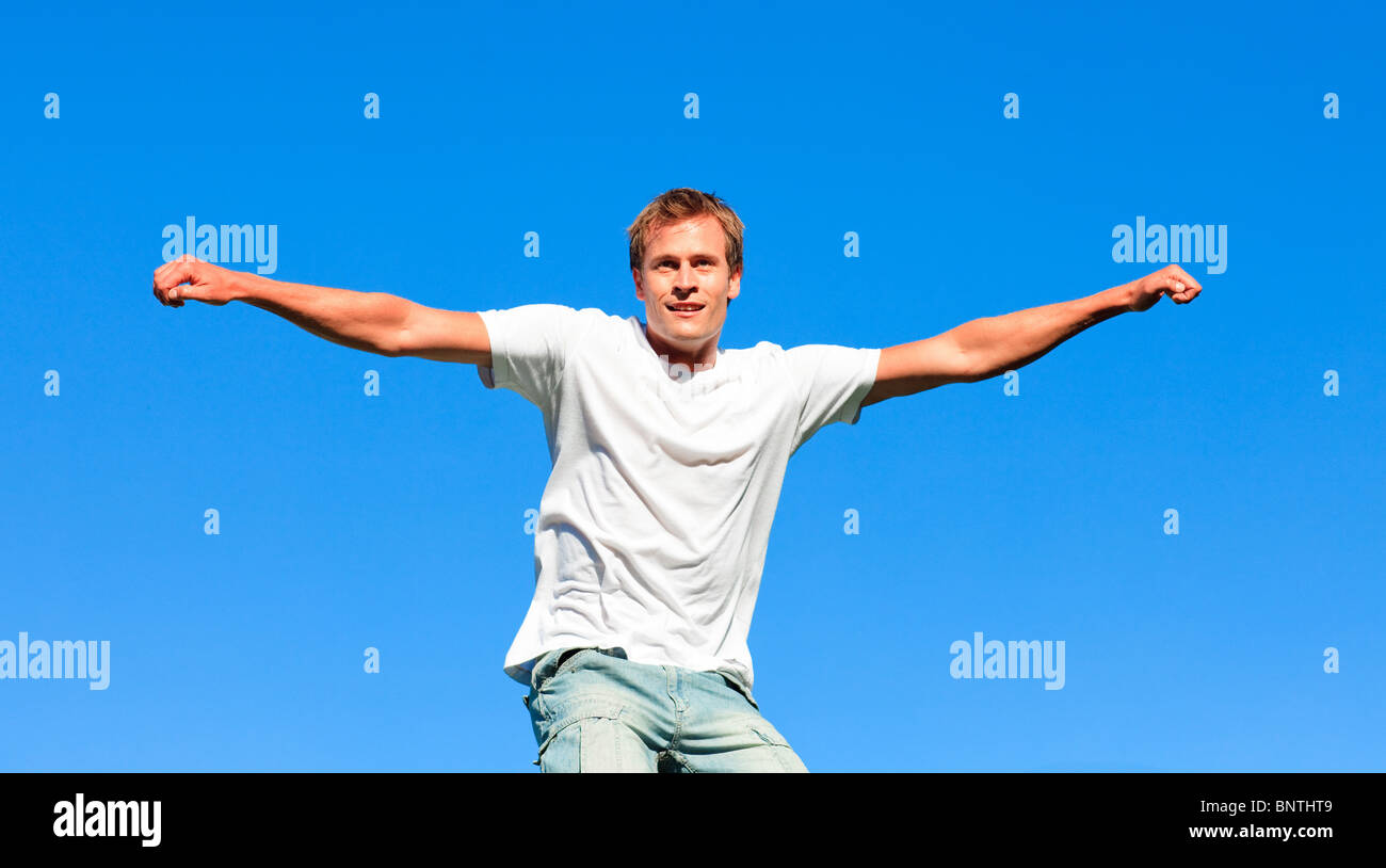 Beautiful man jumping in the air Stock Photo - Alamy