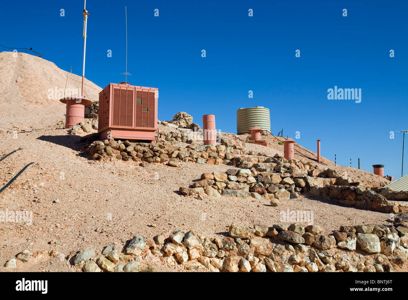 Airvents on the surface provide ventilation for underground buildings known as dugouts. Coober Pedy, South Australia, AUSTRALIA. Stock Photo