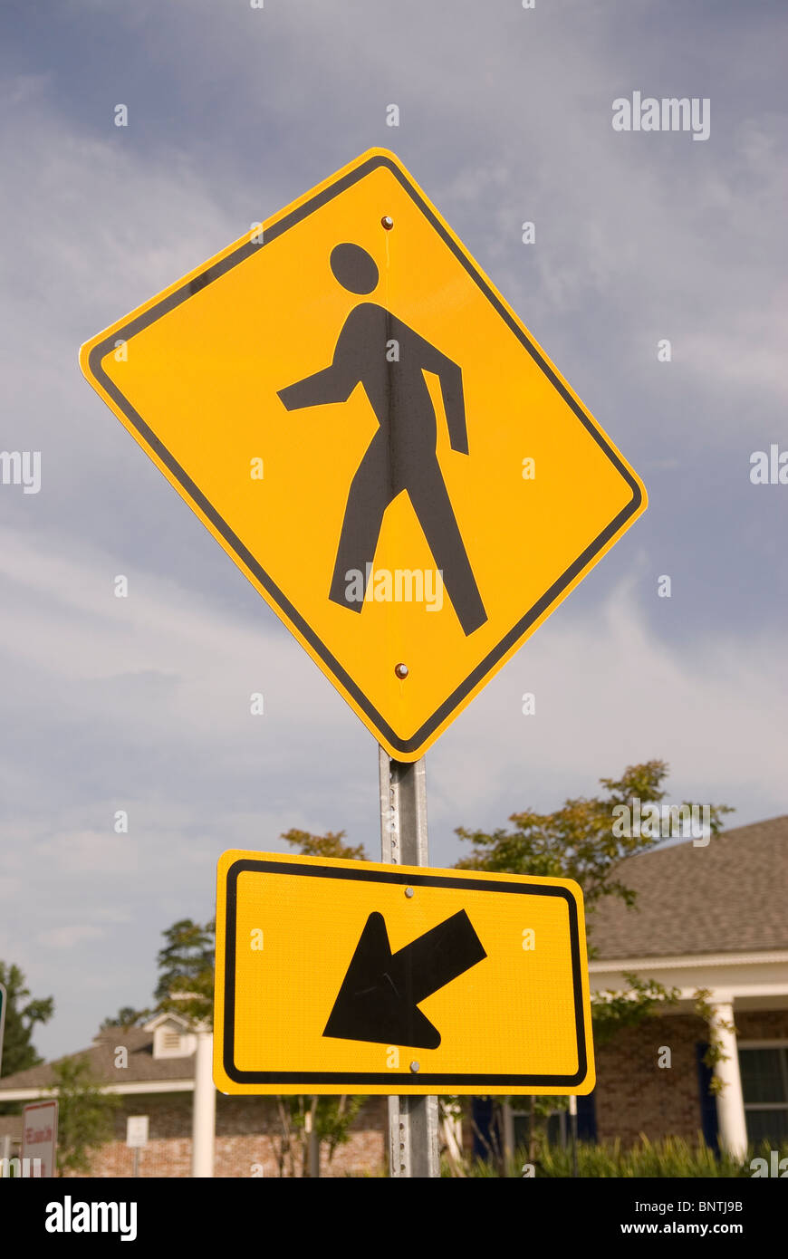 Yellow Pedestrian Crosswalk Traffic Sign with Arrow USA Stock Photo