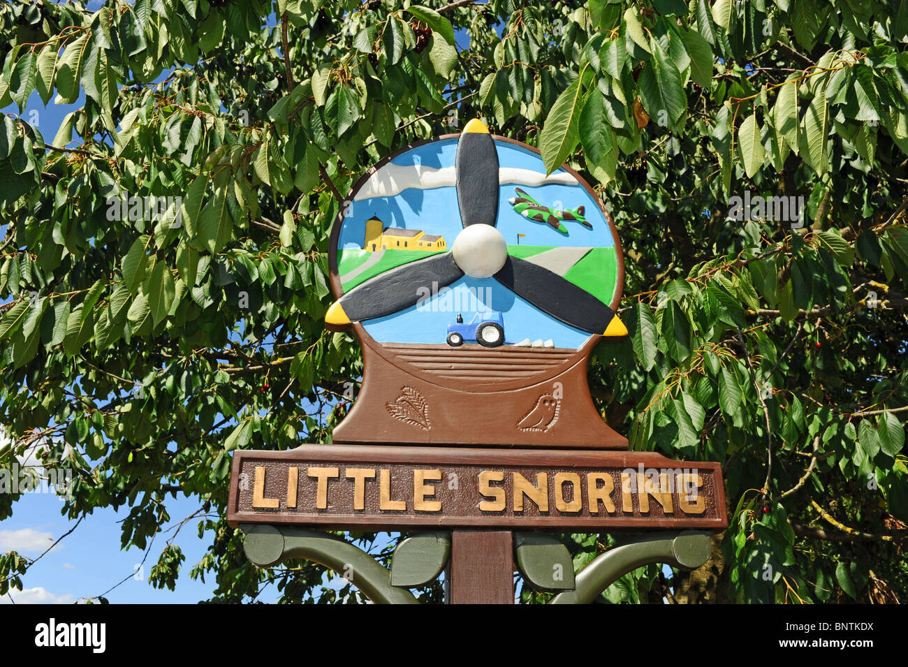 Welcome to Little Snoring Please Drive Carefully village sign in North Norfolk UK Stock Photo