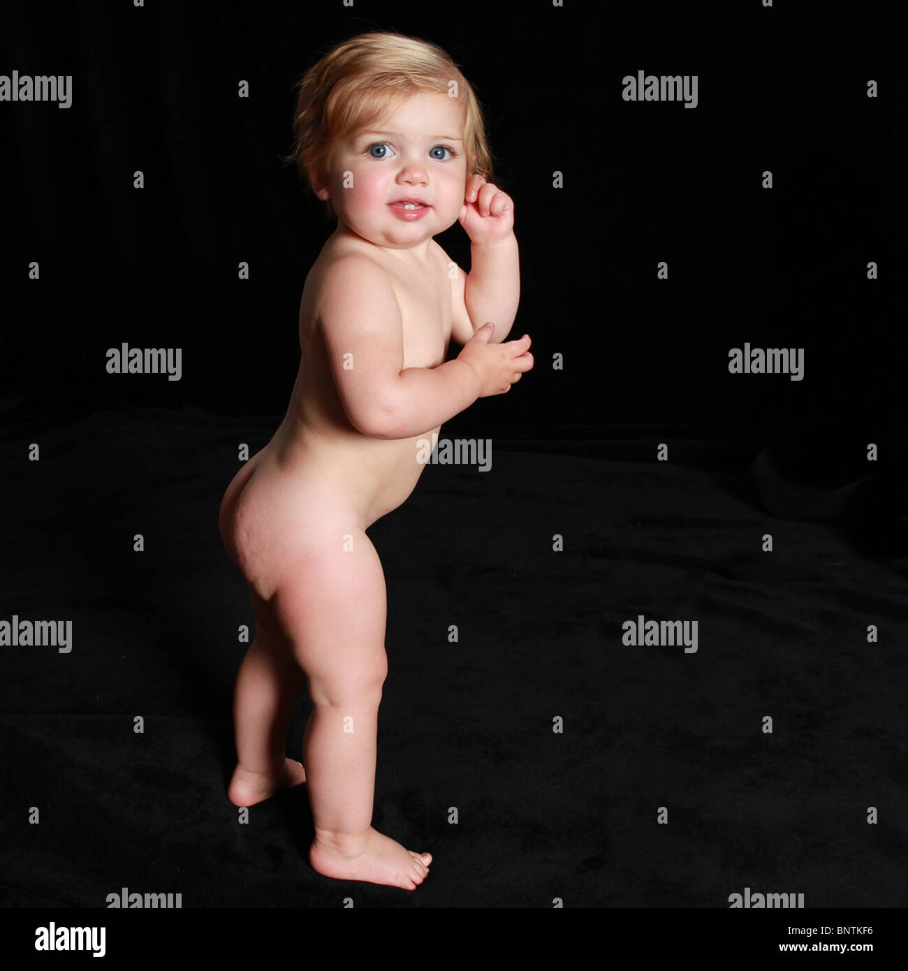 toddlers nude naked toddler standing red hair walking first step Stock Photo - Alamy