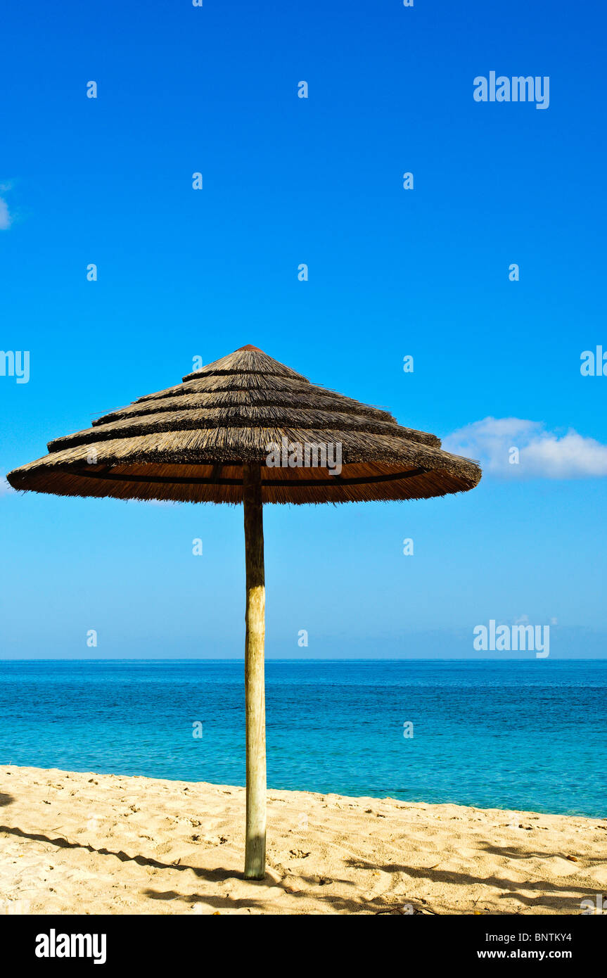 Picture postcard beach umbrella on Grand Anse Beach Grenada Stock Photo