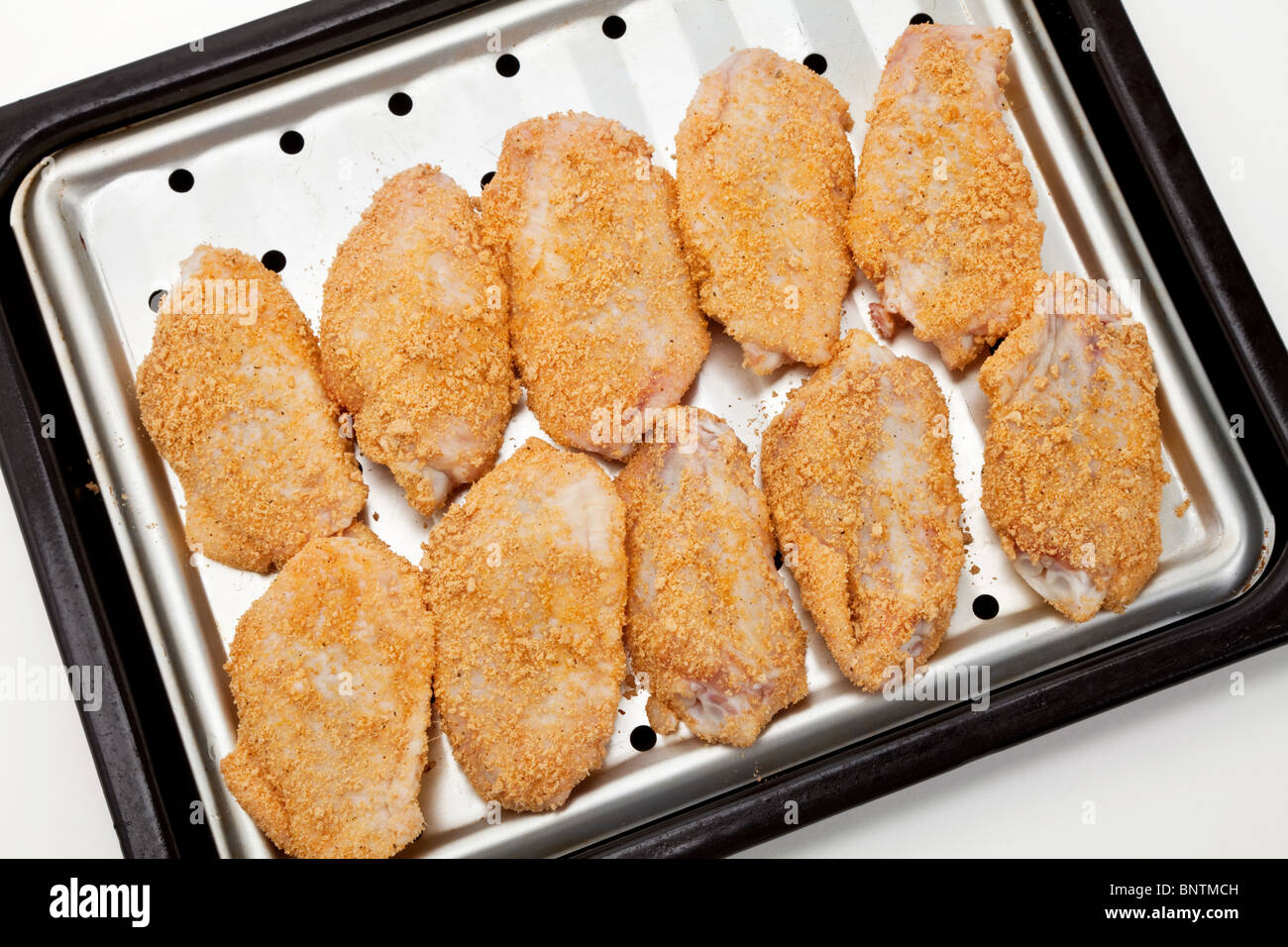 Chicken Wings on Baking Sheet Stock Photo Alamy