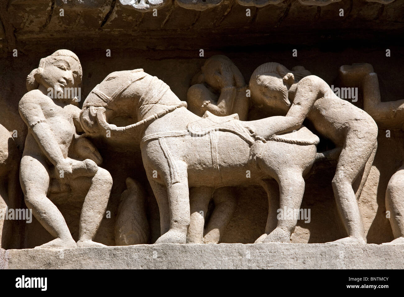 Erotic carved sculptures. Lakshmana Temple. Khajuraho. India Stock Photo -  Alamy