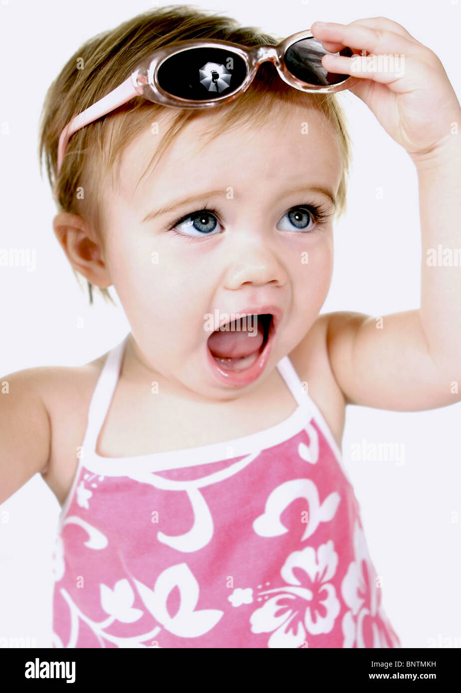 Baby girl in pink swimsuit wearing goggles Stock Photo Alamy