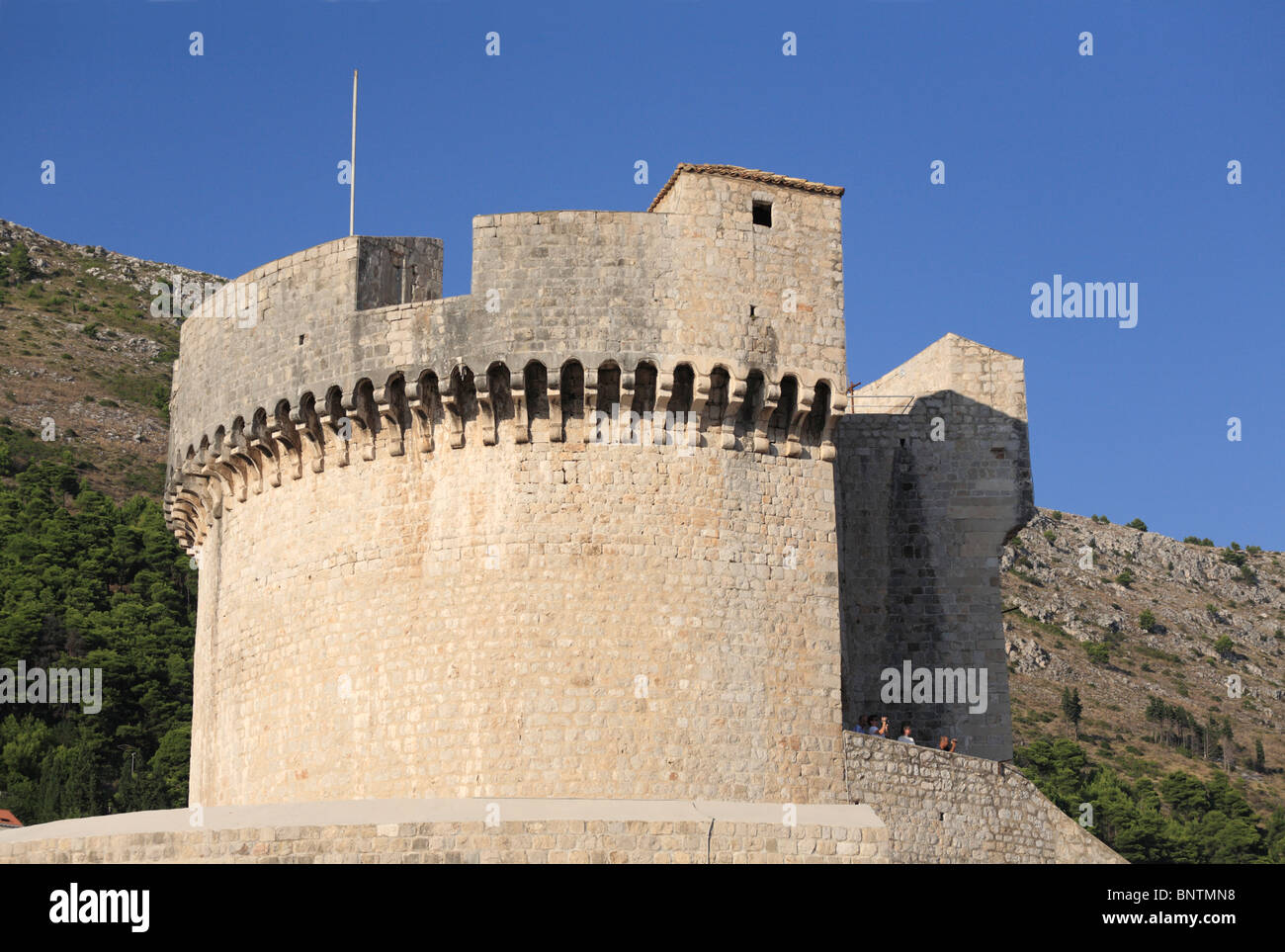Castle tower and ramparts of the fortified city wall around the Old Town area of Dubrovnik Croatia Stock Photo