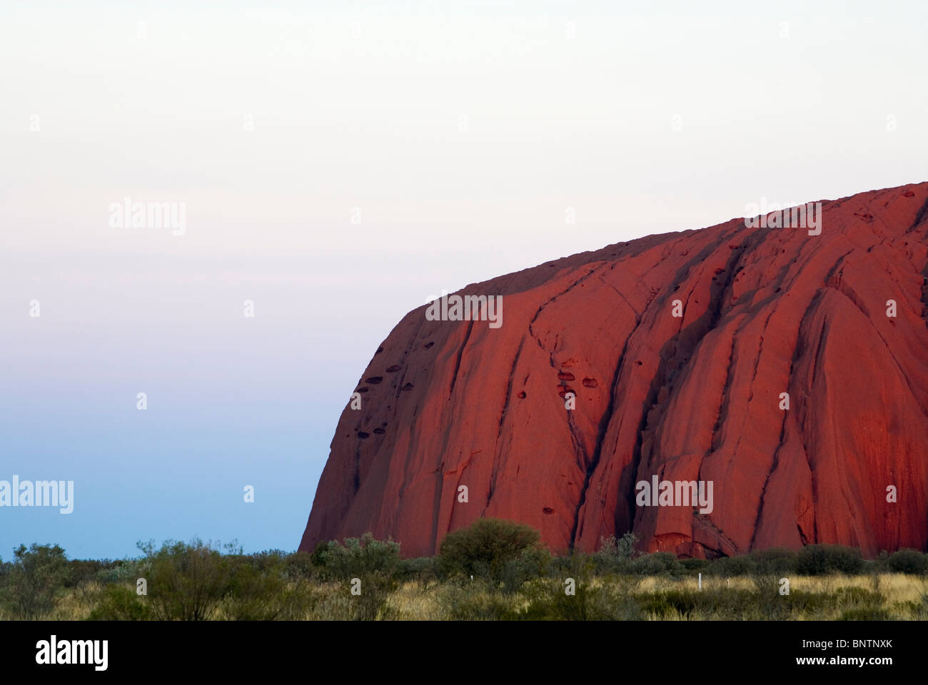 Uluru (Ayers Rock) at sunset. Uluru-Kata Tjuta National Park, Northern Territory, AUSTRALIA. Stock Photo