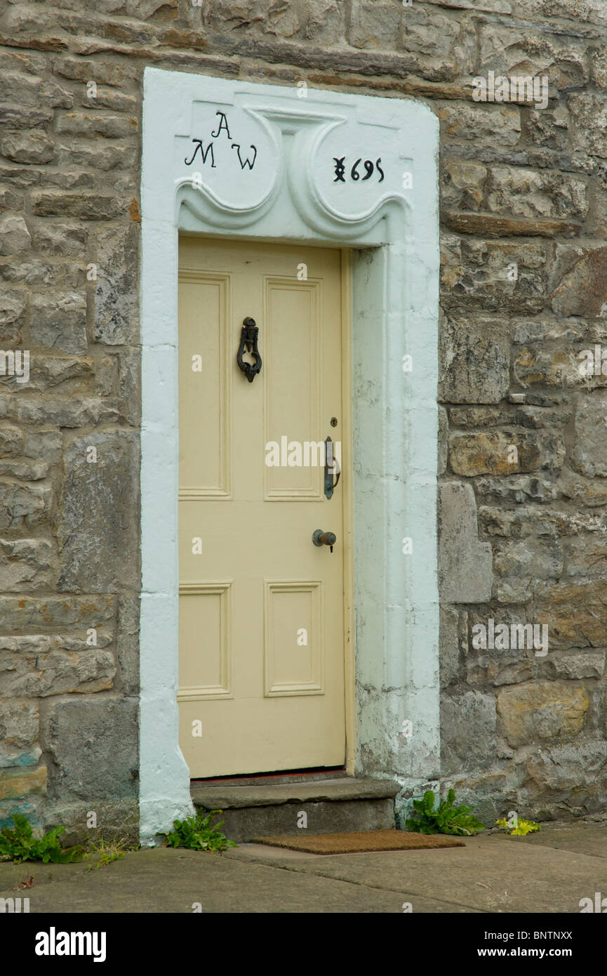 Door with datestone in the village of Gayle, Wensleydale, Yorkshire Dales National Park, north Yorkshire, England UK Stock Photo