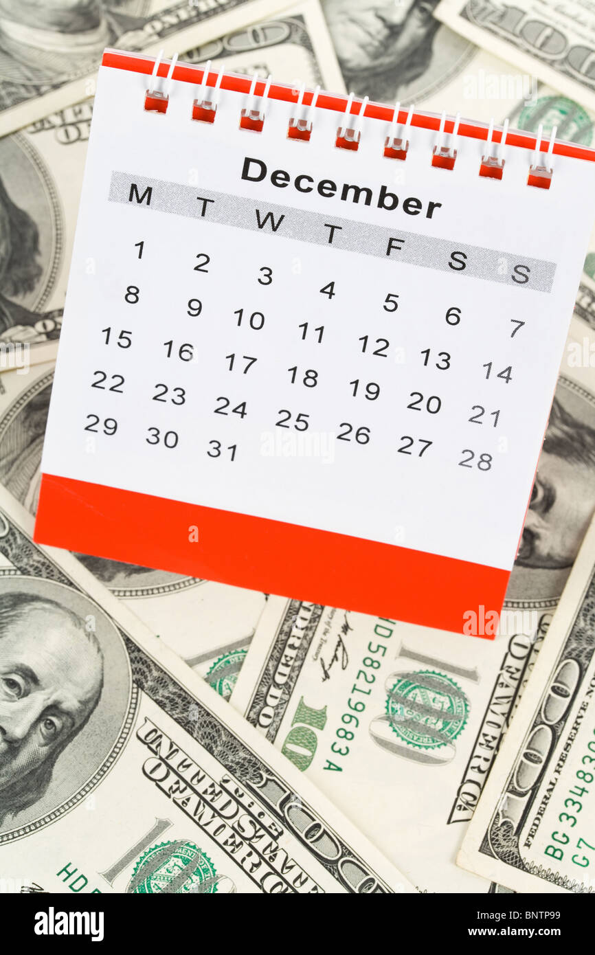 Calendar and dollar, December Stock Photo Alamy