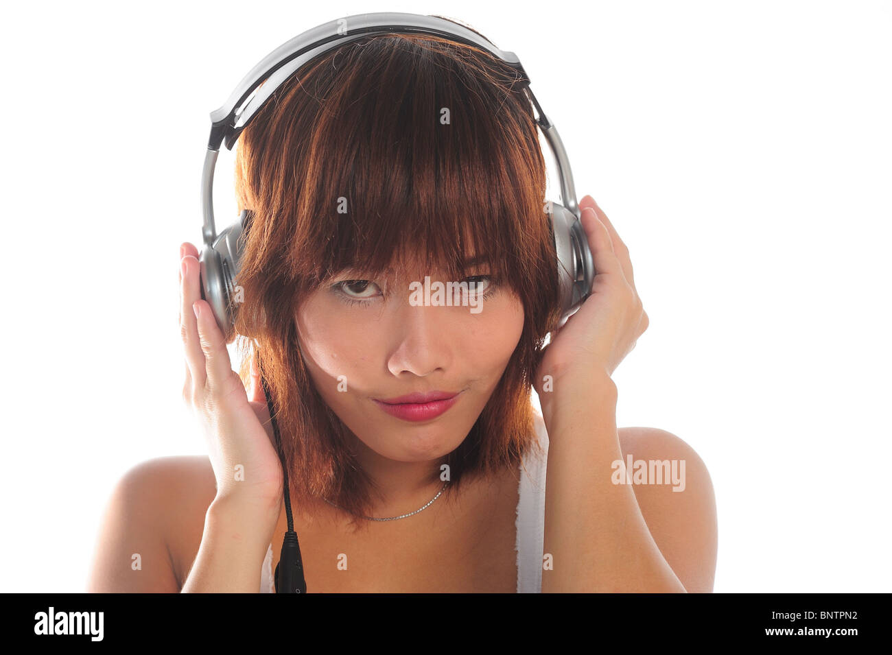 Very seductive young asian woman listening music with headphone Stock ...