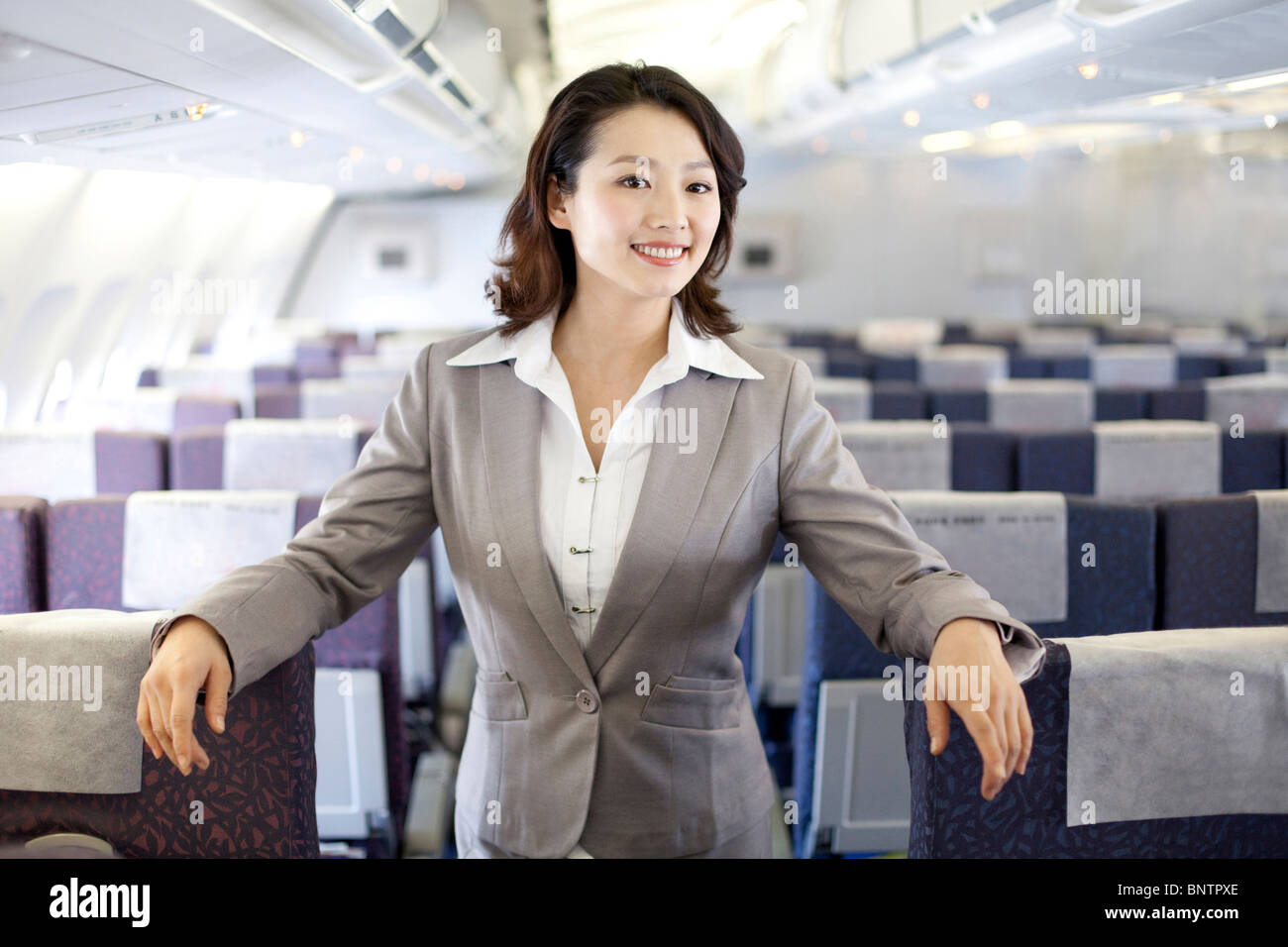 Row of women on a plane hi-res stock photography and images - Alamy