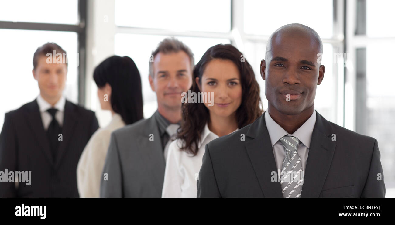 Five person Business team looking at camera and smiling Stock Photo - Alamy