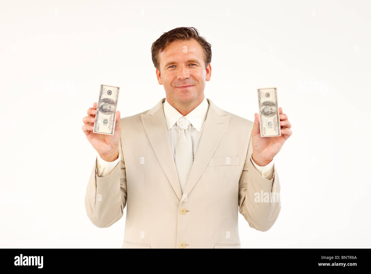 Handsome businessman holding money Stock Photo - Alamy