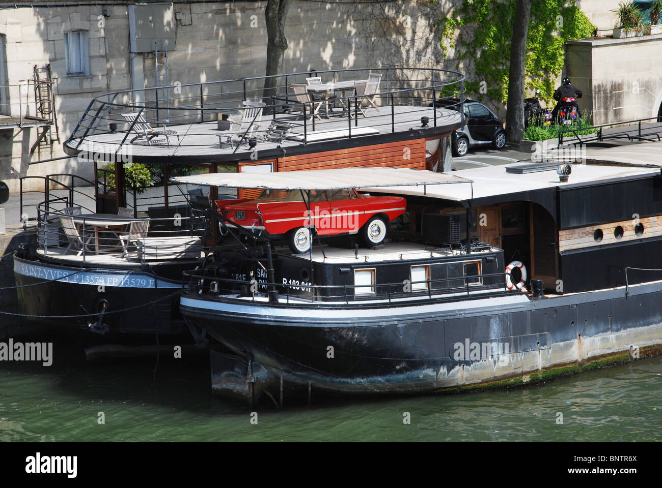 Amphicar, amphibious car parked on houseboat in Paris France Stock Photo
