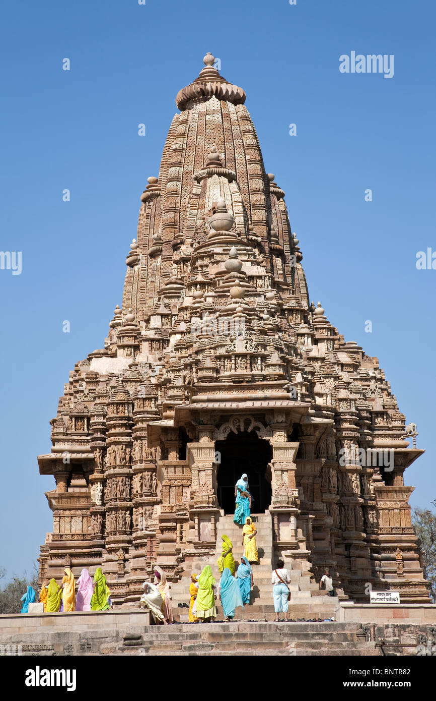 Indian women visiting the Kandariya-Mahadeva temple. Khajuraho. India Stock Photo