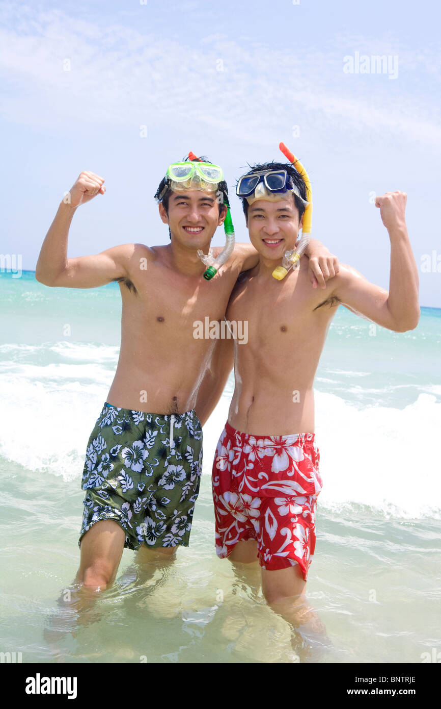 Young men wearing snorkel gear Stock Photo Alamy