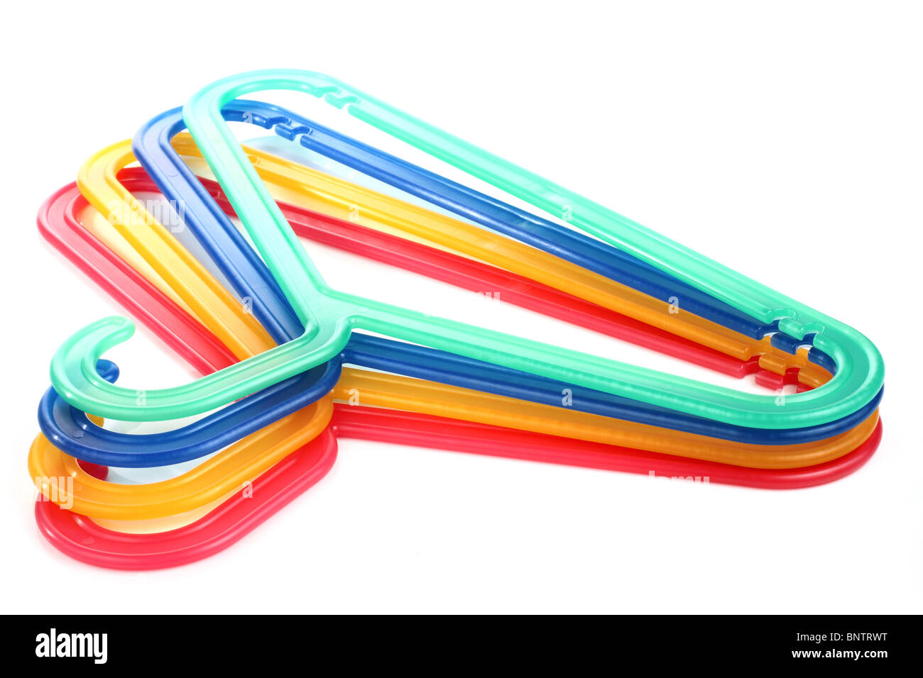 Coloured plastic hangers on a white background Stock Photo