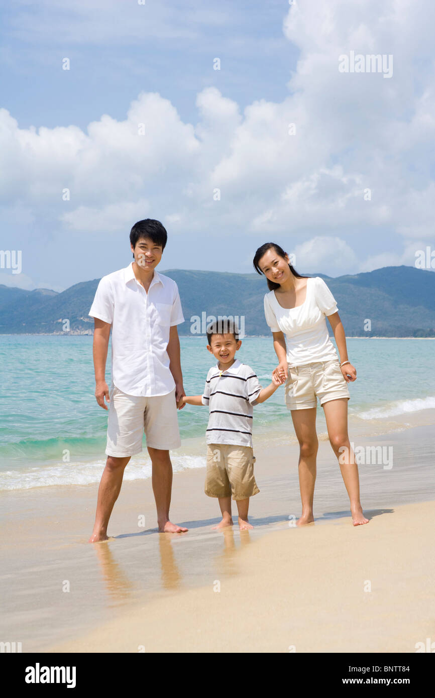 Young family on the beach Stock Photo - Alamy