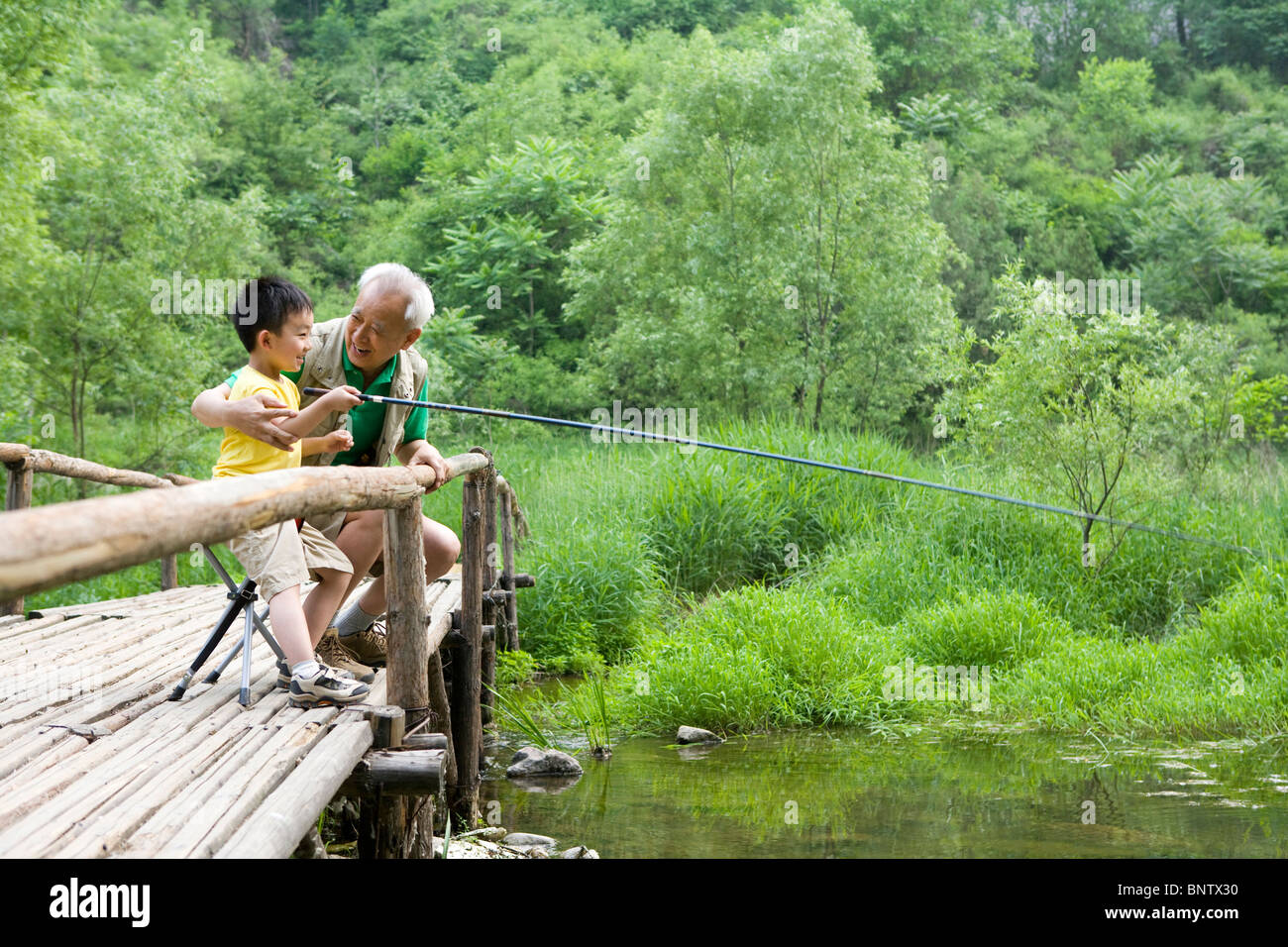 Two boys fishing asia hi-res stock photography and images - Alamy