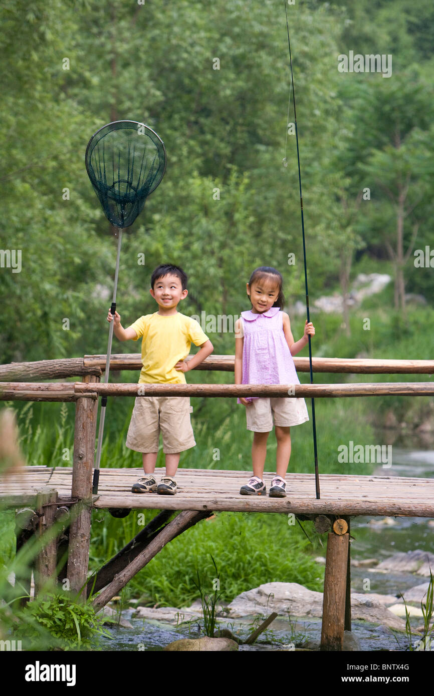 Two boys fishing asia hi-res stock photography and images - Alamy