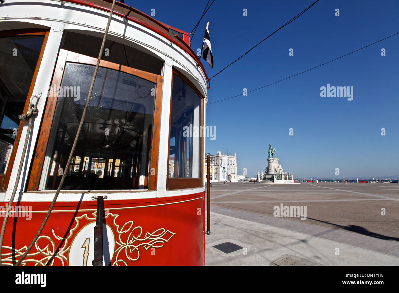 A typical red street car on Lisbon's Praça do Comércio Stock Photo Alamy