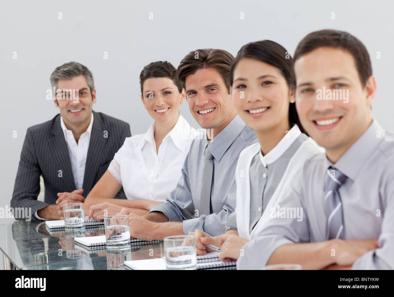 Smiling business people in a meeting Stock Photo - Alamy