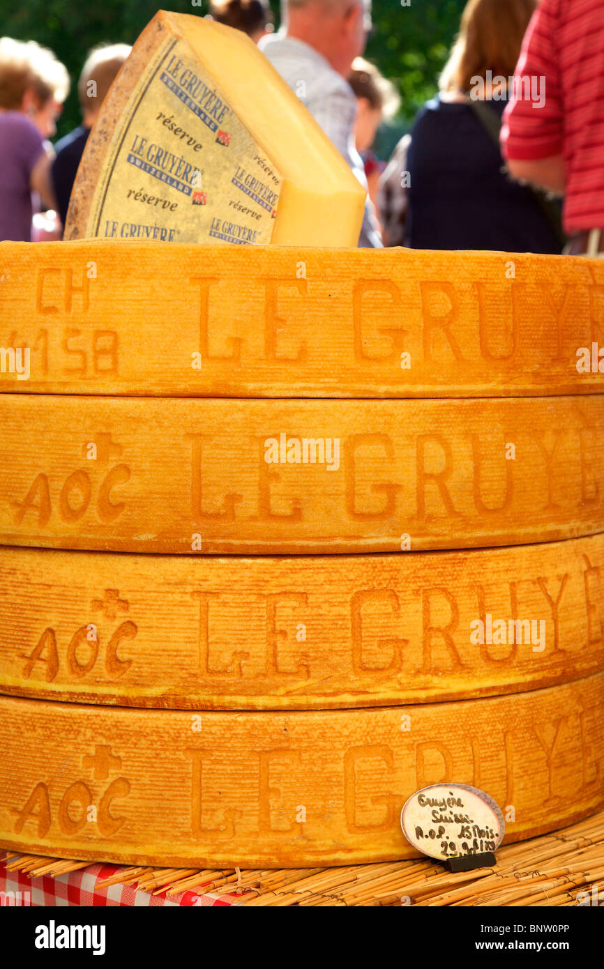 Fresh gruyere swiss cheese for sale at the market Stock Photo