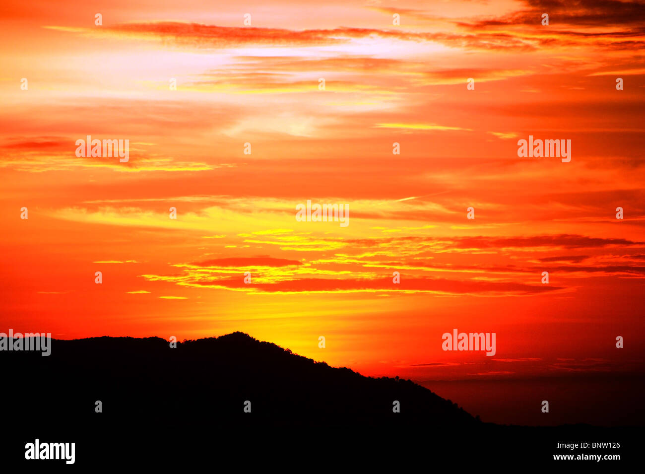 Sunset with a kind on mountains Matang from height of the bird's flight. Malaysia. Borneo. Kuching. Stock Photo