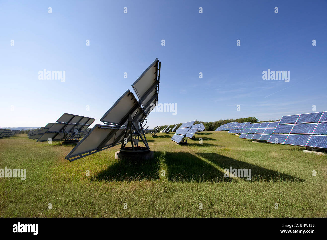 Solar panels mounted on so called movers which automatically direct the panels towards the sunshine, Germany Stock Photo