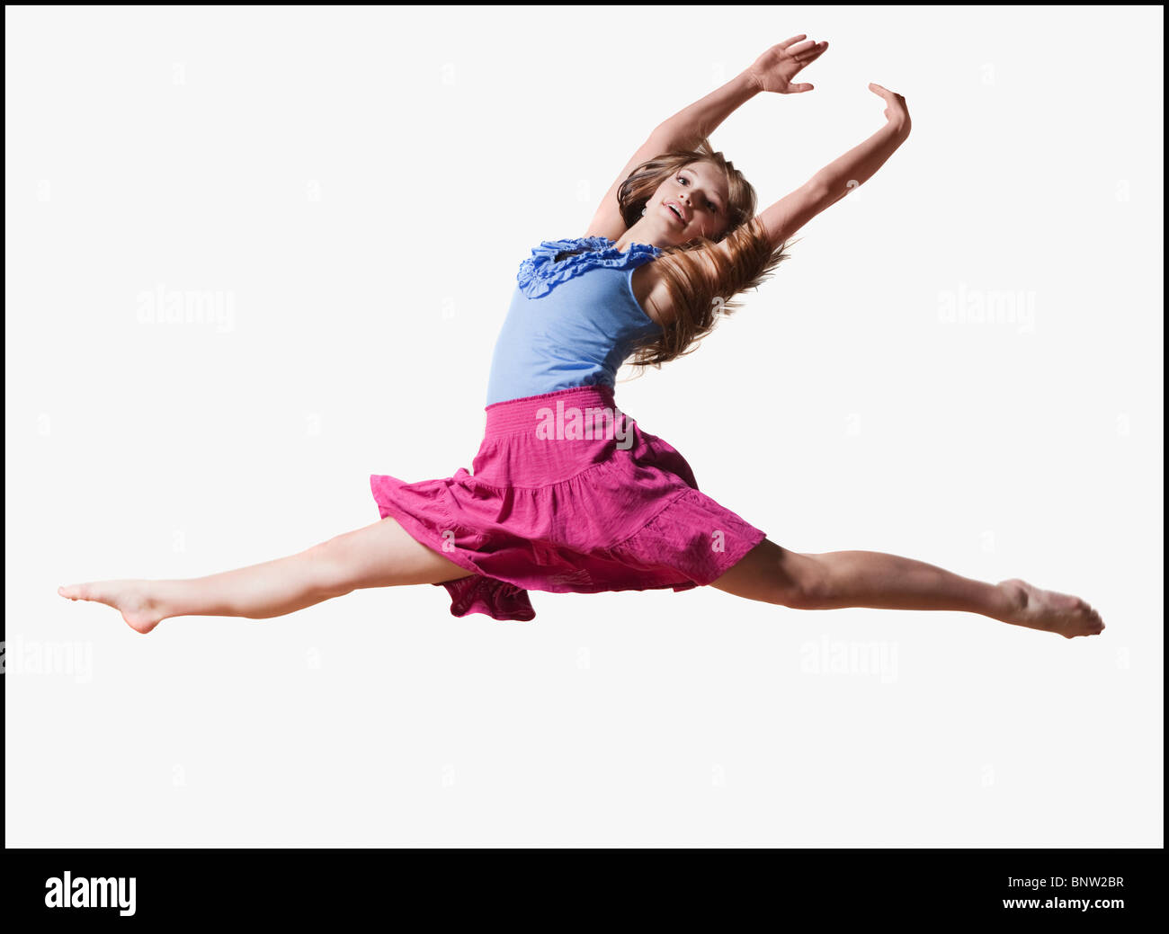 Female dancer jumping gracefully in the air Stock Photo