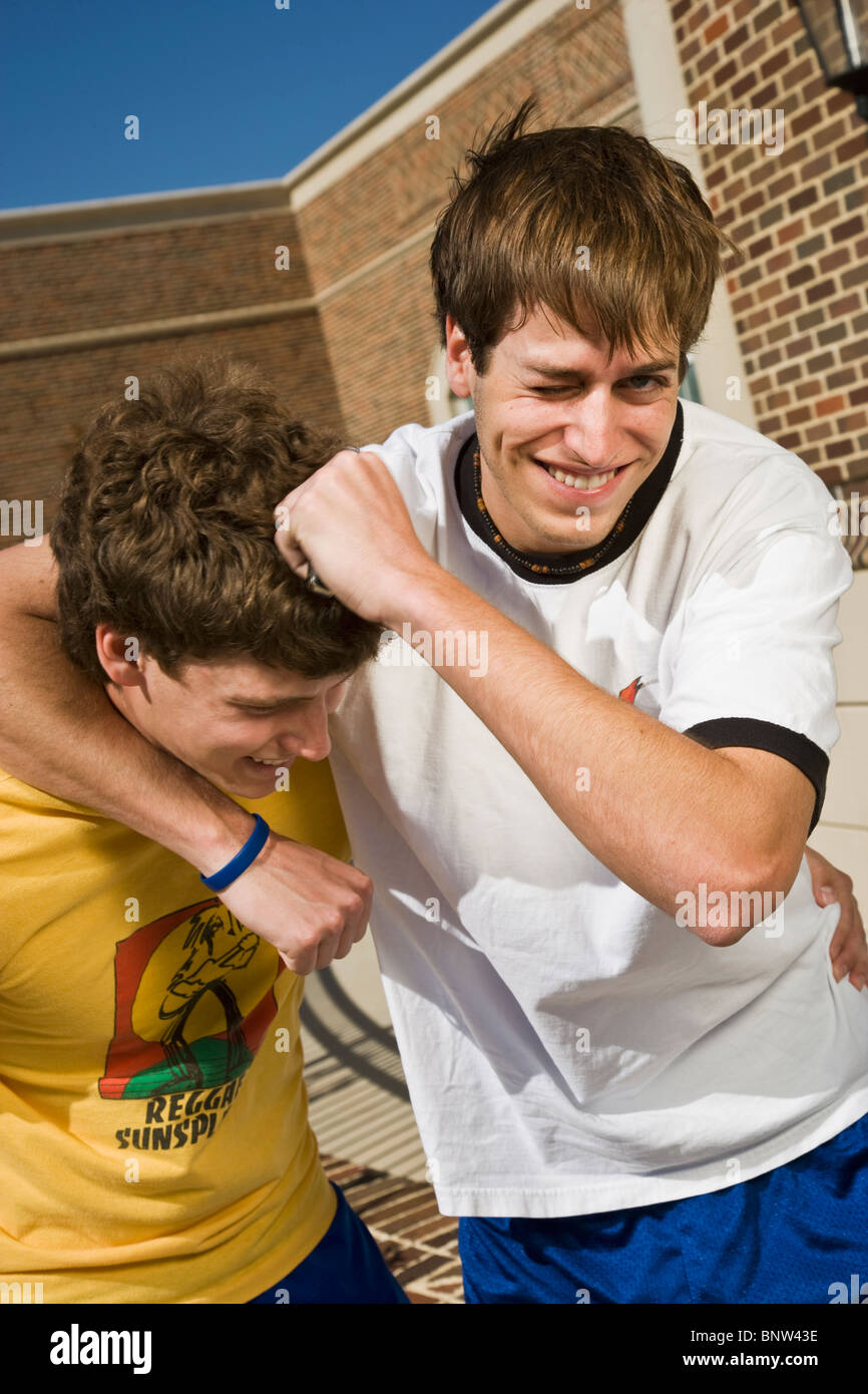 Boys play fighting Stock Photo