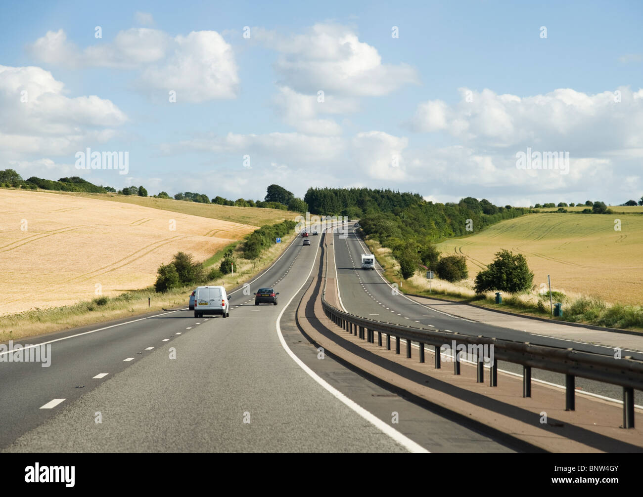 Cars on a dual carriageway road in Britain Stock Photo