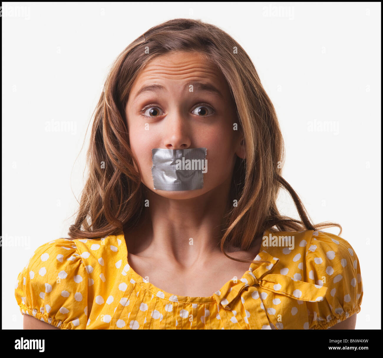 Teenage girl with duct tape on her mouth Stock Photo - Alamy