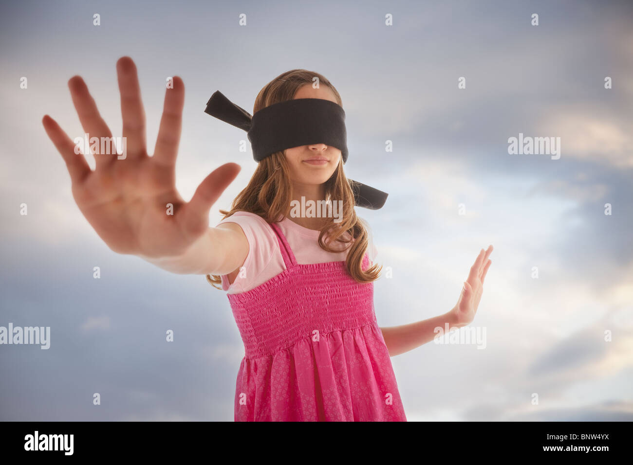 Blindfolded teenage girl Stock Photo