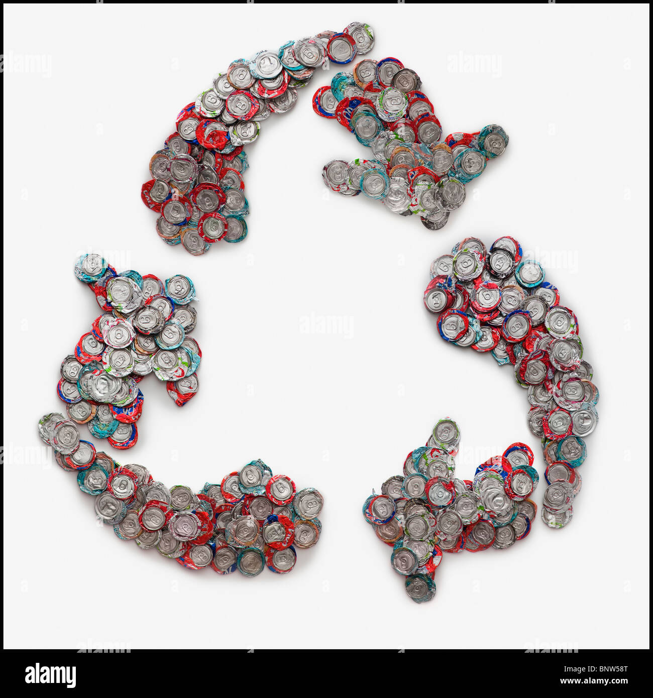 Crushed can arranged in the shape of recycle symbol Stock Photo