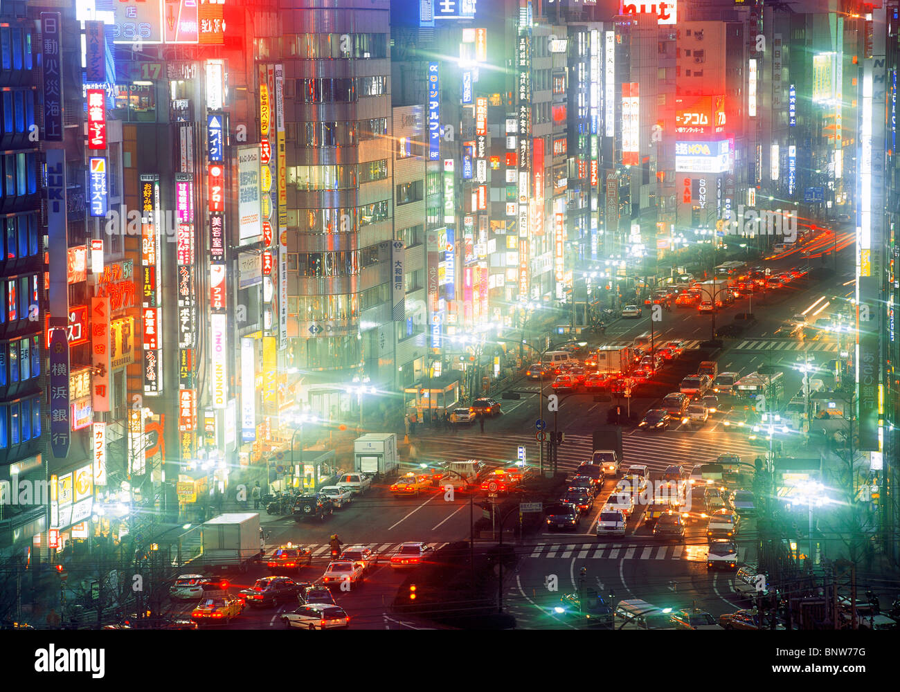 Neon lights and busy streets in Shinjuku District of Tokyo at night