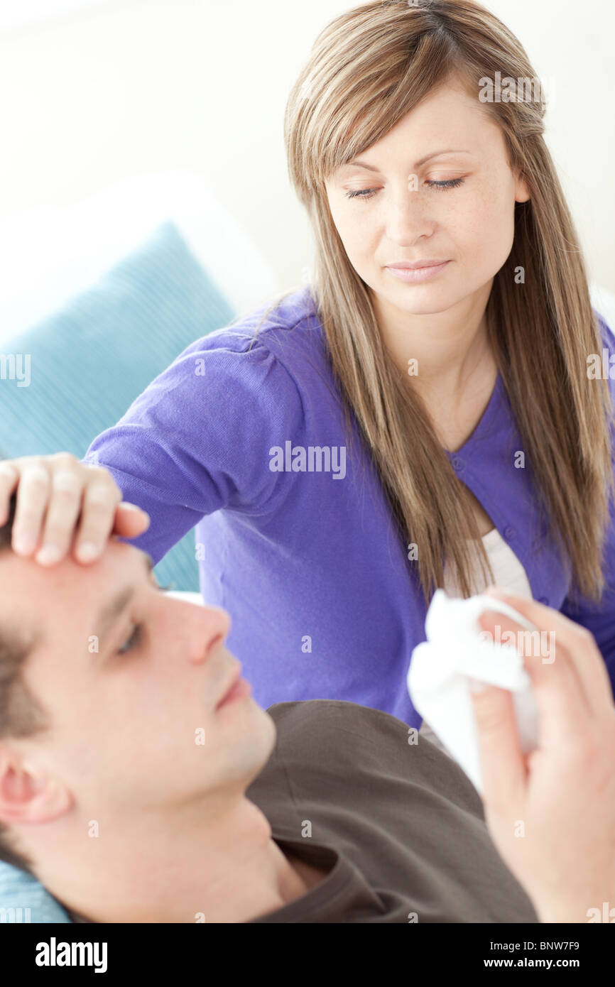 Bright woman taking care of her husband Stock Photo